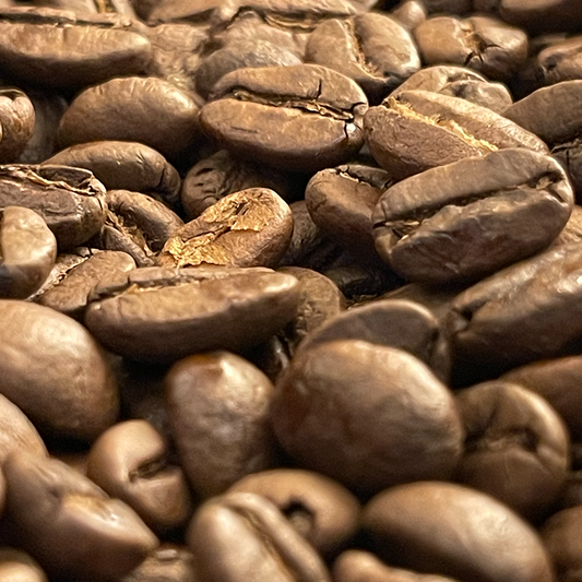 A close-up view of medium-roasted coffee beans