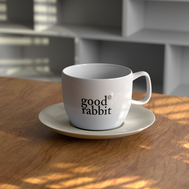 A cup of Rooibos tea on a wooden office table