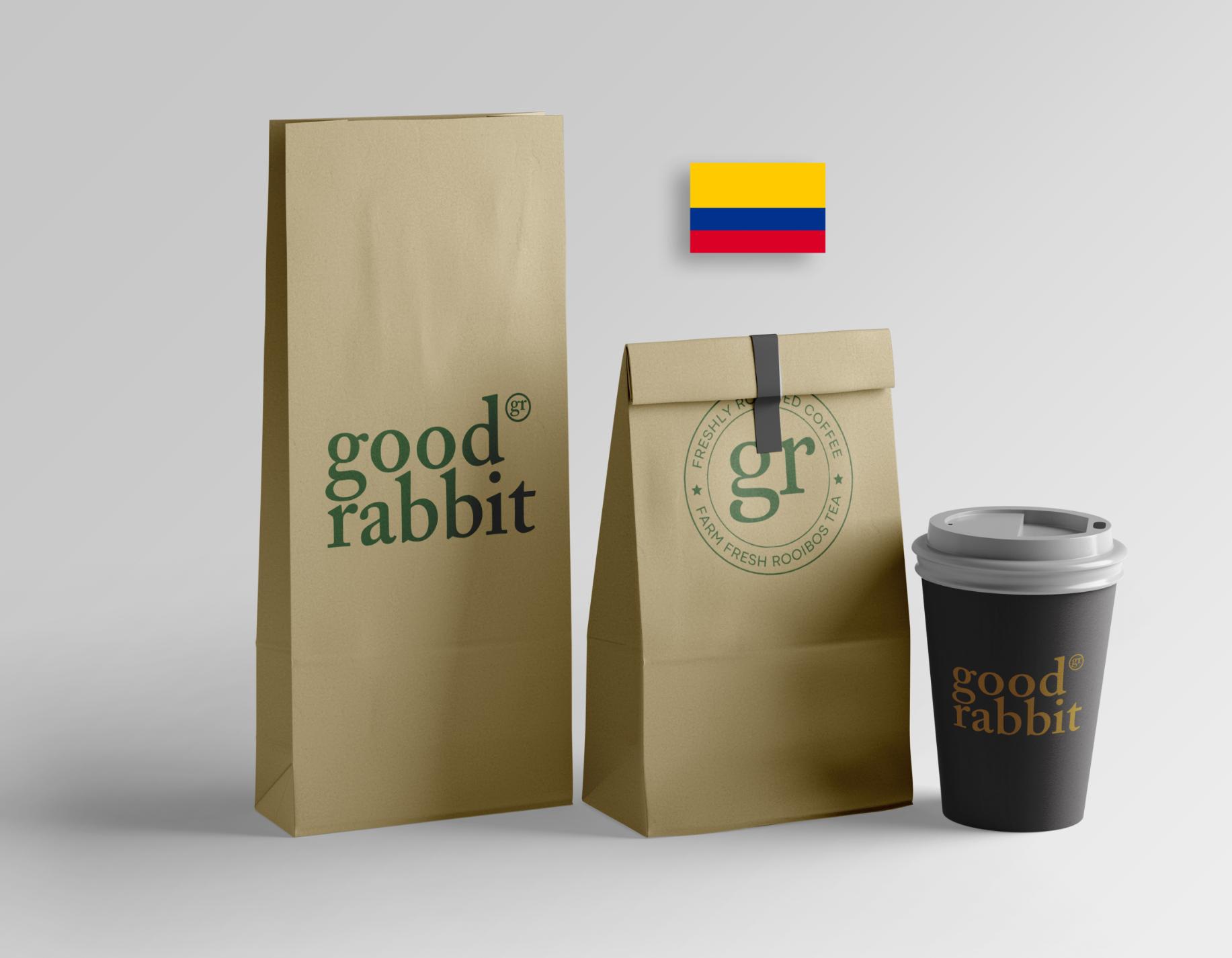 Isometric view of kraft packaging with Colombian coffee beans and a coffee cup adorned with the Colombian flag. Dive into the rich culture and vibrant flavors of Colombia with every sip of coffee. Experience the authentic essence of Colombia's coffee tradition in each cup. #ColombianCoffee #CoffeeCulture #ColombianFlag