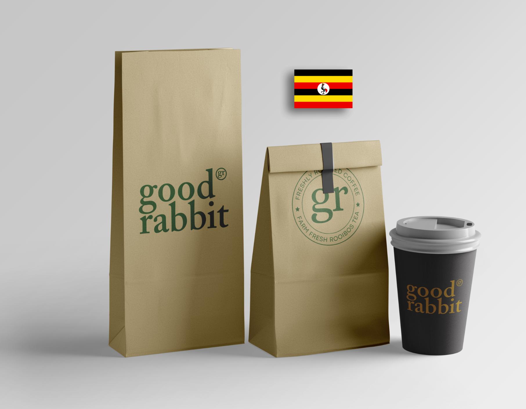 Isometric view of kraft packaging with Ugandan coffee beans and a coffee cup featuring the Ugandan flag. Immerse yourself in the rich heritage and bold flavors of Uganda with every sip of coffee. Experience the authentic essence of Uganda's coffee tradition in each cup. #UgandanCoffee #CoffeeCulture #UgandanFlag